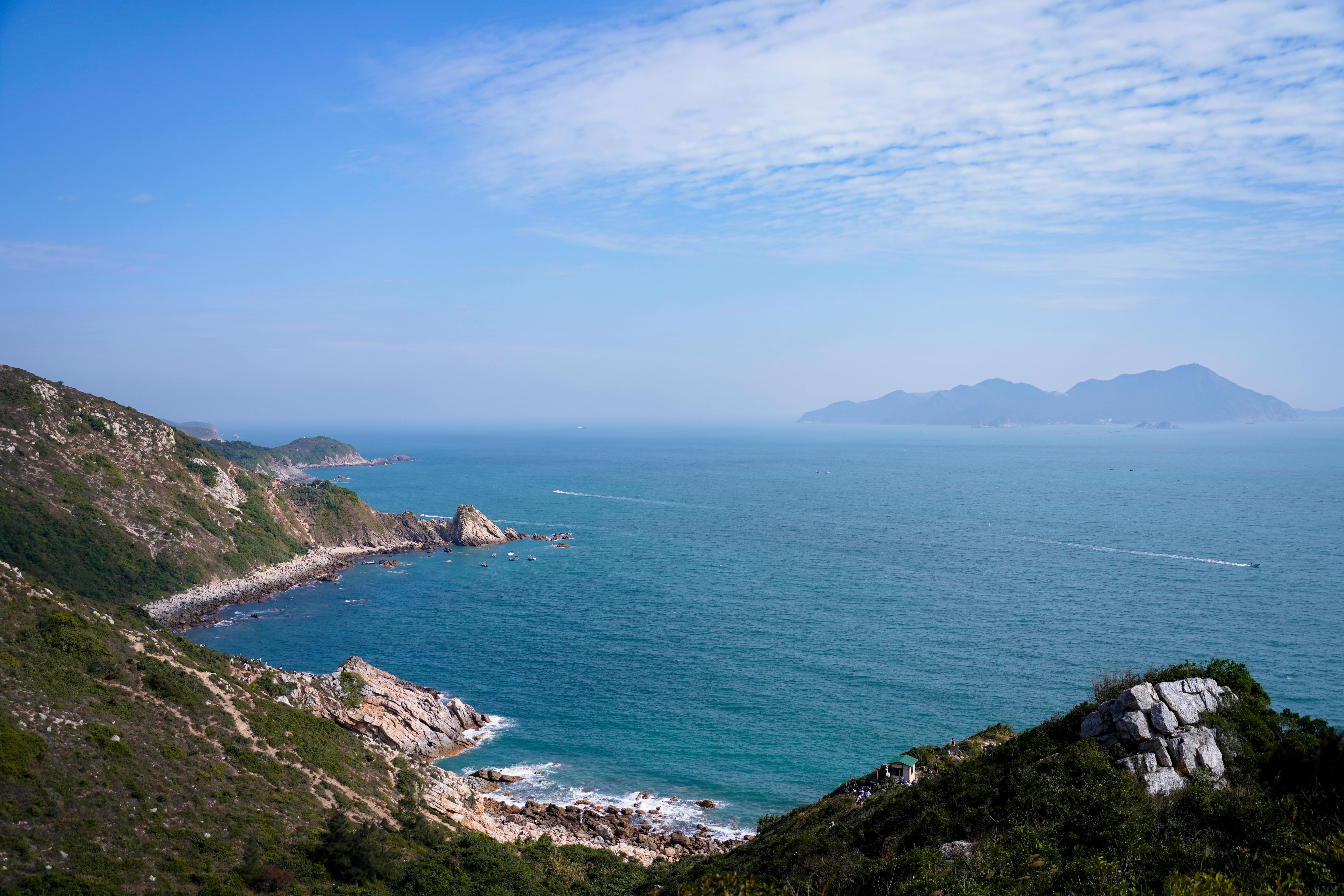 Luxury yacht sailing along the sunny Mediterranean coast